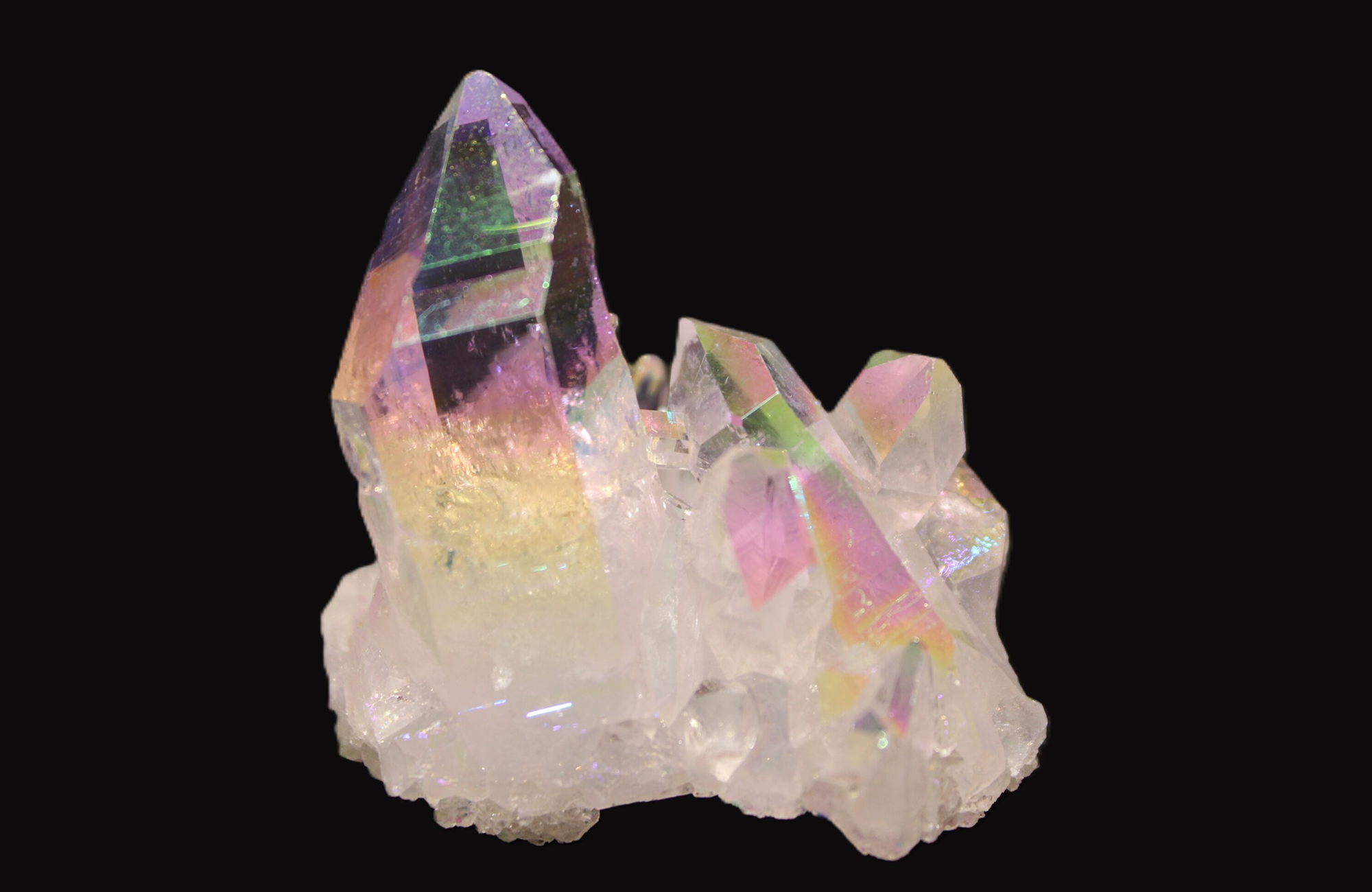 Iridescent crystal cluster on black background.