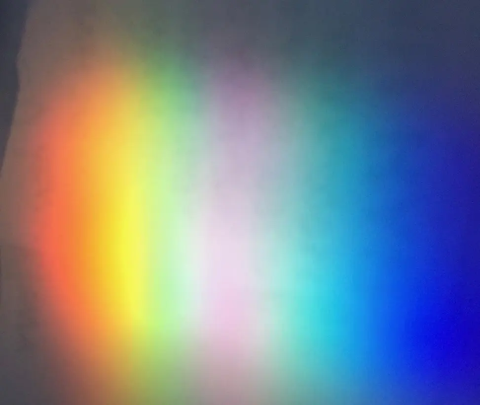 Colorful light spectrum on a surface.