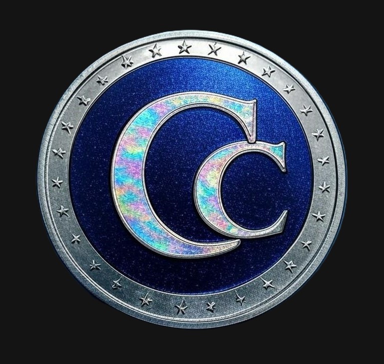 A blue and silver coin with the letter c in it.